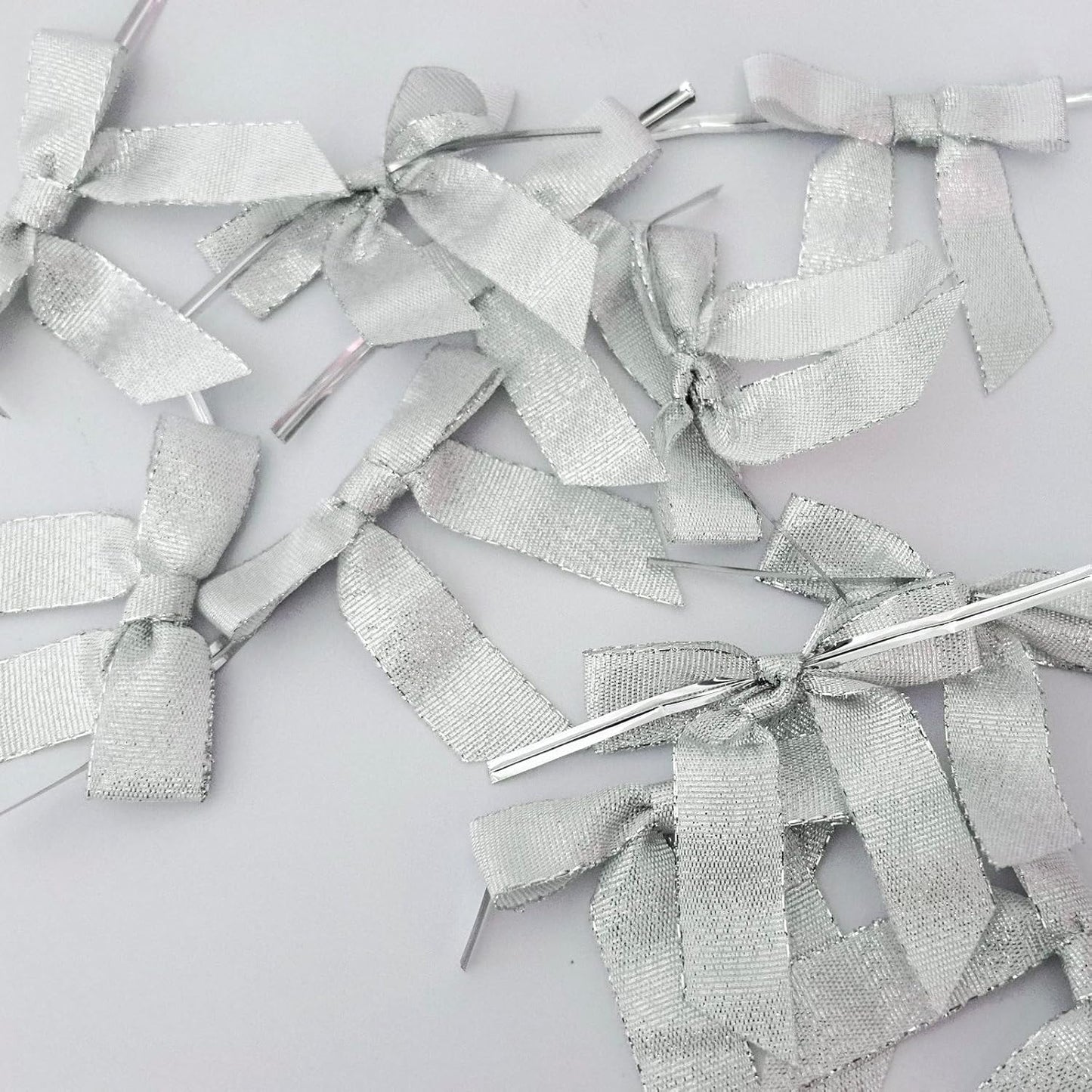 50pcs 2-1/2" Metallic Satin Silver Bows for Crafts Pretaied Christmas Bows with Twist Ties Hot Cut Tails for Christmas Decoration (Silver)