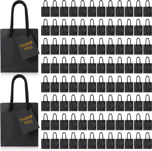 Sherr 100 Pack Mini Gift Bags Bulk, 4 x 2.75 x 4.5 Inches Paper Bags with Tags, Extra Small Paper Gift Boxes with Handles for Birthday, Party Favors, Weddings, Small Business(Black)